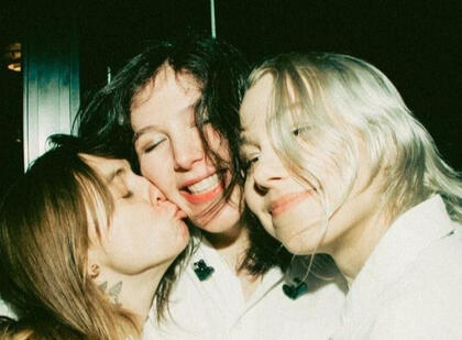 boygenius (left to right: phoebe bridgers, julien baker, lucy dacus) sitting and hugging during their interview with genius